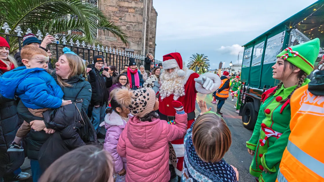 The visitors made plenty of stops along the way, greeting families, handing out sweets, and collecting all-important Christmas lists from children