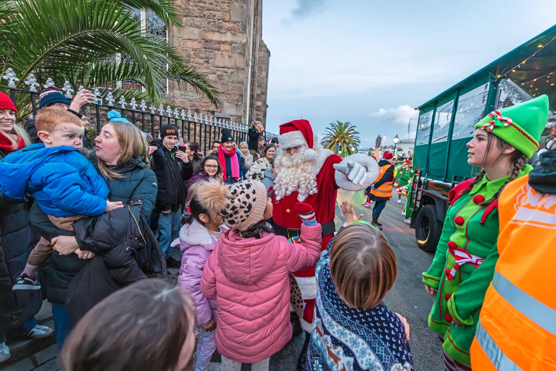 The visitors made plenty of stops along the way, greeting families, handing out sweets, and collecting all-important Christmas lists from children