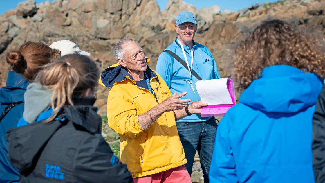 Tour guide Nev Jehan leading a seaweed foraging walking tour at Port Soif