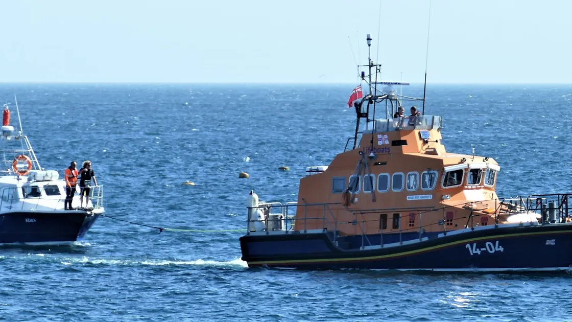 An ignominious end to the first passenger-carrying voyage of the new Alderney ferry, the Azula, operated by Alderney Ferry Services, which had to be towed in by the RNLI lifeboat, Roy Barker I, after breaking down with engine problems yesterday morning. (Picture by David Nash)