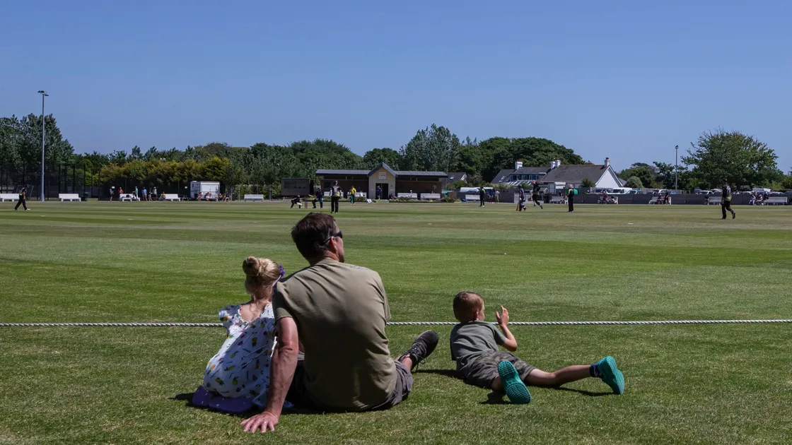 Just a perfect day to watch cricket: A family sit down at KGV to watch the first T20 game played as part of the island's Covid-19 Lockdown sporting exit plan.(Picture by www.guernseysportphotography.com, 28319942)