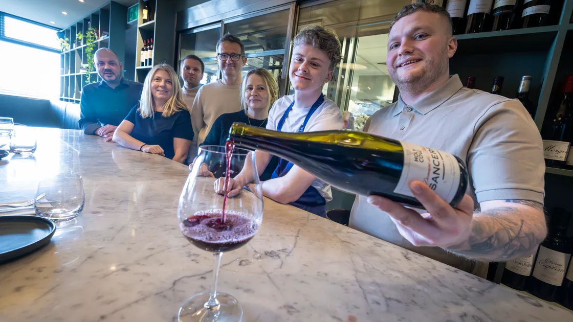Pictured in Red are, left to right, Red operations manager Ingus Vainovskis, Randalls finance director Lucy Hadlington, operations director Rauls Silts, MD Matt Polli, HR director at Red Vicky Montgomery, Red chef Will Mahy and its HR director Ben Field