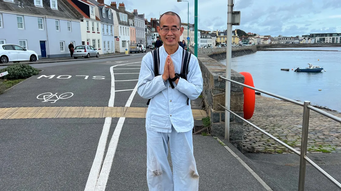 Rudolph Xiaodong Nie visited the island to walk three steps and pray 999 times as part of his 20+ year goal to travel the world to pray for people's happiness. (32656240)