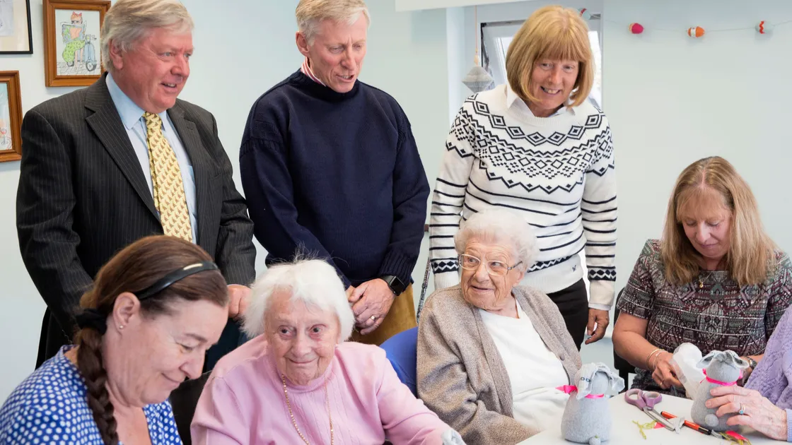 Lt-Governor Vice Admiral Sir Ian Corder, centre, Lady Corder and Guernsey Blind Association trustee Hugh Bacon watch clients and staff making Easter bunnies. (Picture by Adrian Miller, 24389781)