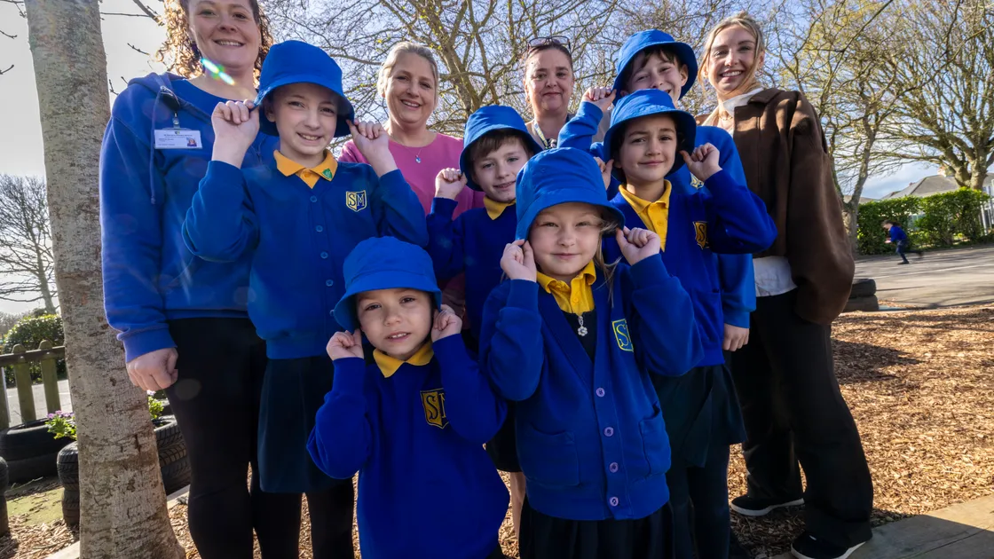 St Martin’s Primary School pupils have each received a sun hat as part of their summer uniform. Left to right, Martine Stuart from the PTA, Chloe Woodhead, PTA chair Victoria Oliver, Coby Taylor, Ryan Beatty, headteacher Clare Giles, Isabella Mauger, Este Morris-McCarthy, Oscar Brehaut, and Specsavers brand development manager Amy O’Brien. 					 (Picture by Peter Frankland, 34685356)