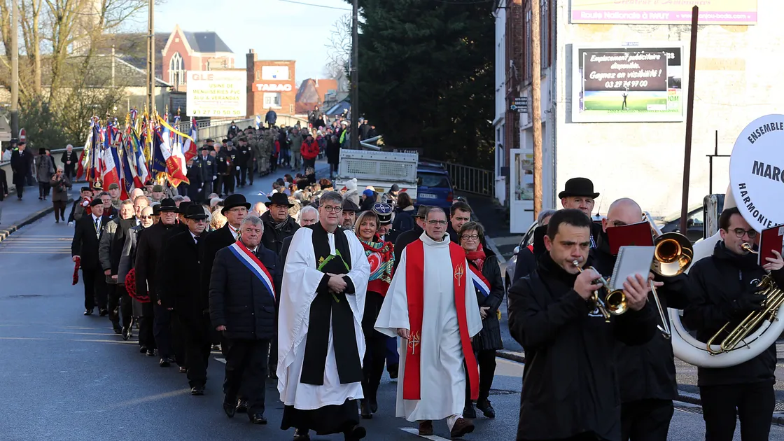 The Royal Guernsey Light Infantry Commemoration in Masnieres, France, in 2017. The parade marched to the memorial on Rue Verte. The Dean of Guernsey, Tim Barker, is pictured with Catholic Abbe Henri Bracq. (Picture by Peter Frankland, 28958988)