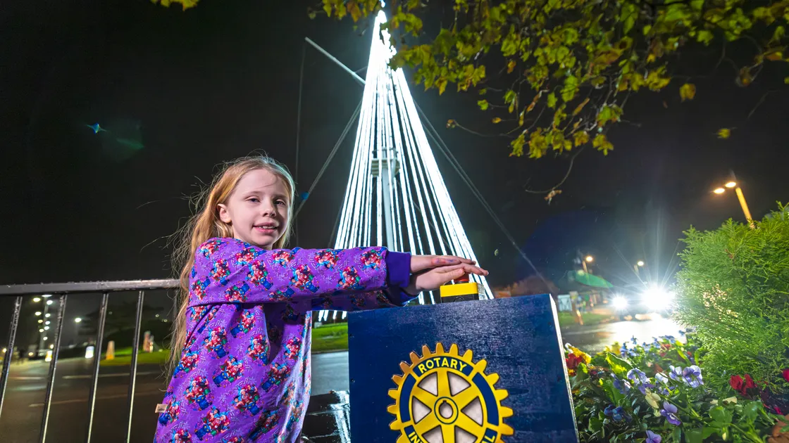Eight-year-old Willow Nash switching on the Tree of Joy at the Weighbridge Roundabout last night
