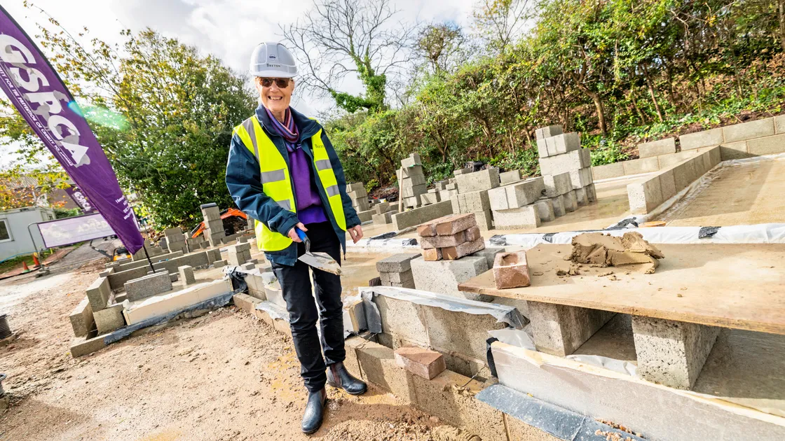 Long-serving GSPCA member Yvonne Chauvel had the honour of laying the first foundation brick of its new Wildlife Hospital