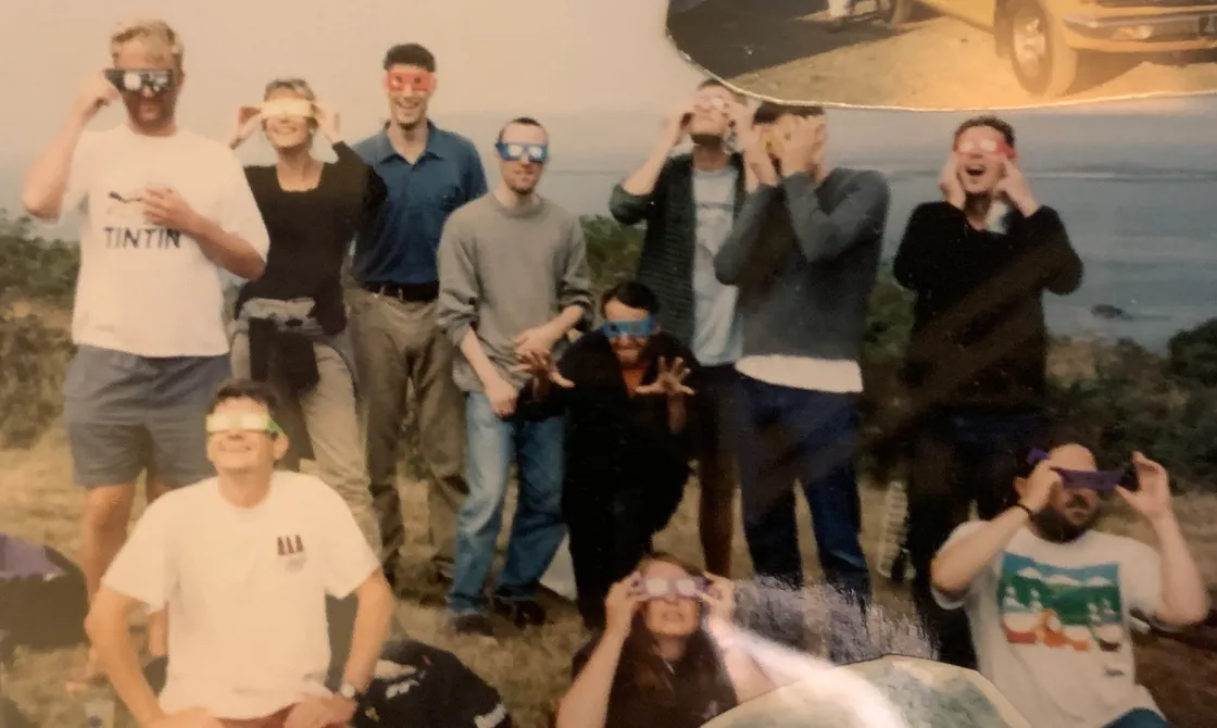 A section of a friend’s collage of old photos shows a crowd of us watching the eclipse on Tourgis Hill, Alderney, on 11 August 1999. That’s me sitting on the right in the South Park T-shirt, and Julie’s sitting centre. 
