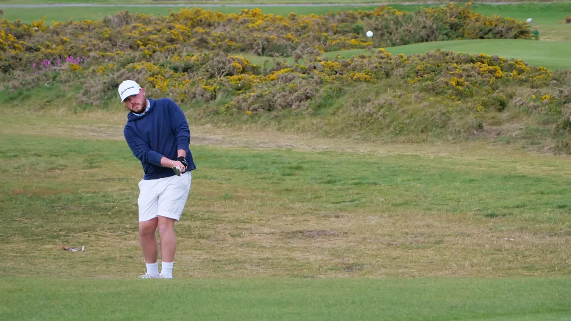 Ronnie Casey plays a chip shot to the second green.