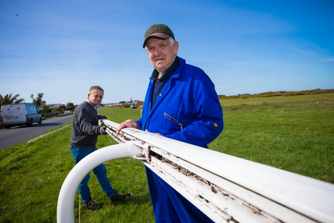 Jim Jamouneau, right helping Thady Griffith put up the rails for a Guernsey Race Club meeting. (Picture by Peter Frankland, 29640239)