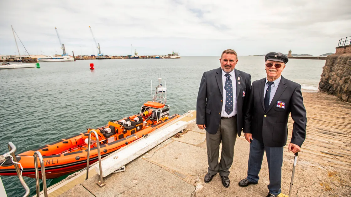 The official naming ceremony for St Peter Port RNLI’s new Atlantic 85 B class lifeboat, Harold Hobbs, took place yesterday. Mr Hobbs was killed in June 1940 by German war planes while serving on the Guernsey lifeboat. At the ceremony were family members, including Harold’s son Tony (right), and great-nephew Jason, now the operations manager at St Peter Port RNLI. (Picture by Sophie Rabey, 33374993)