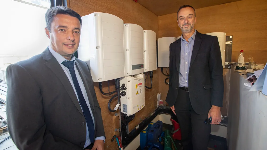 Boley Smillie, chief executive of Guernsey Post, left, and Alan Bates, chief executive of Guernsey Electricity at Envoy House. (Picture by Sophie Rabey, 25813546)