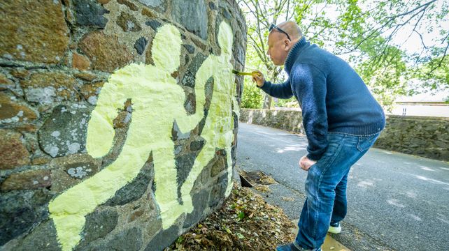 Deputy Le Brun puts his painting skills into action
