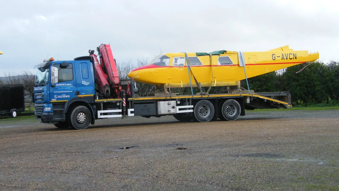 The restored Islander's fuselage loaded up and ready to be moved to its new home. (29188270)