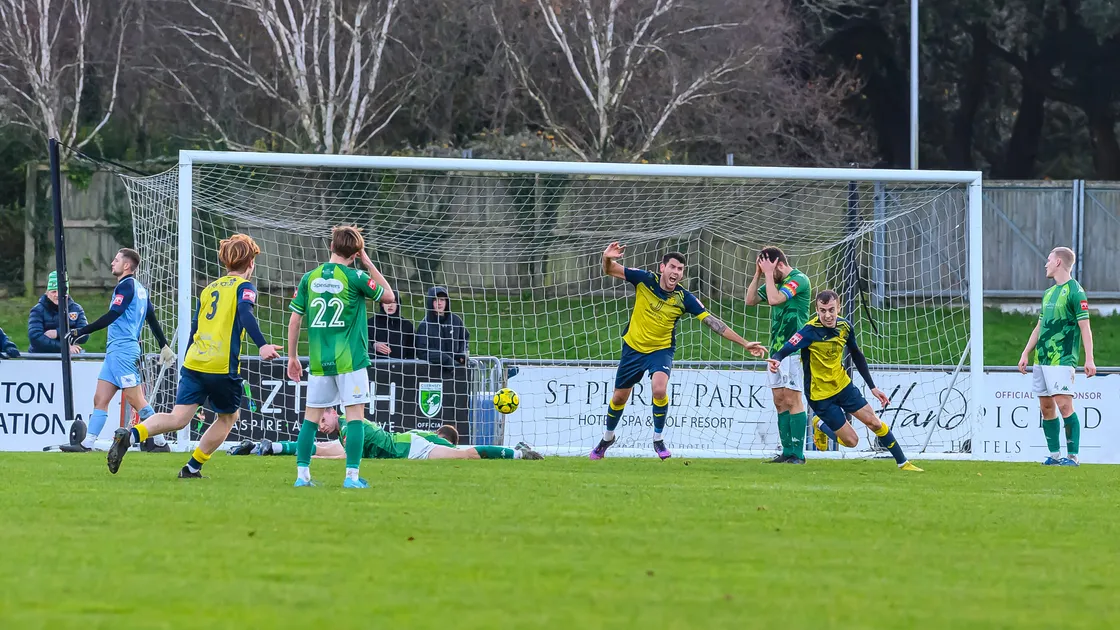 Moneyfields goal-scorer James Franklyn wheels away after scoring their dramatic 97th-minute winner at Footes Lane while the Guernsey FC players are left disconsolate having seen all three points slip from their grasp from a game they should have won comfortably. (Picture by Andrew Le Poidevin, 33831767)