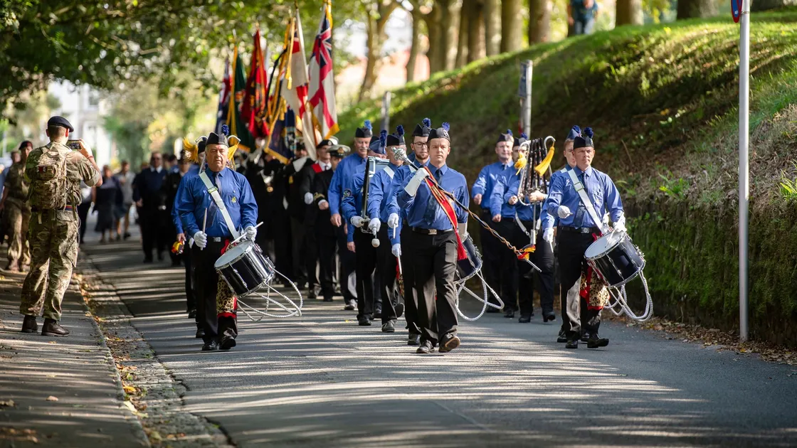 The standard bearers marched behind the Boys’ Brigade band from the Ladies’ College to Le Foulon for the service.