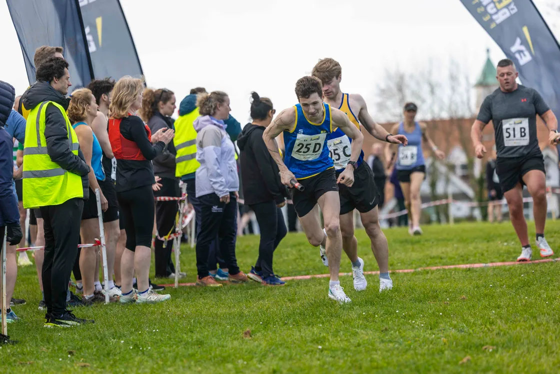 Anchor-leg runner Jack Rees takes the baton from Mikey Ingrouille for the victorious Muggle the Smuggles team.