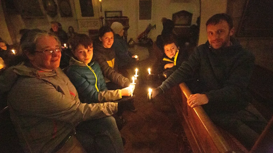 The Jamieson family lighting candles in the Town Church. Left to right, Sarah, Daniel, Eleanor, Thomas and Matthew. (30547455)