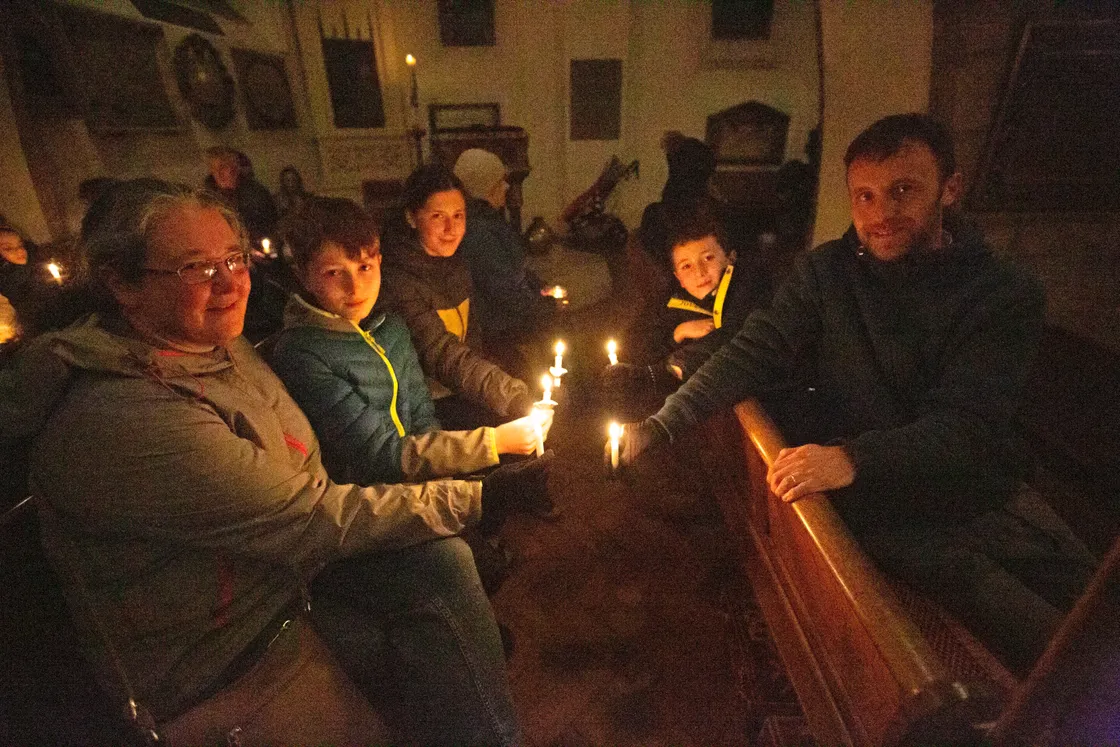 The Jamieson family lighting candles in the Town Church. Left to right, Sarah, Daniel, Eleanor, Thomas and Matthew. (30547455)