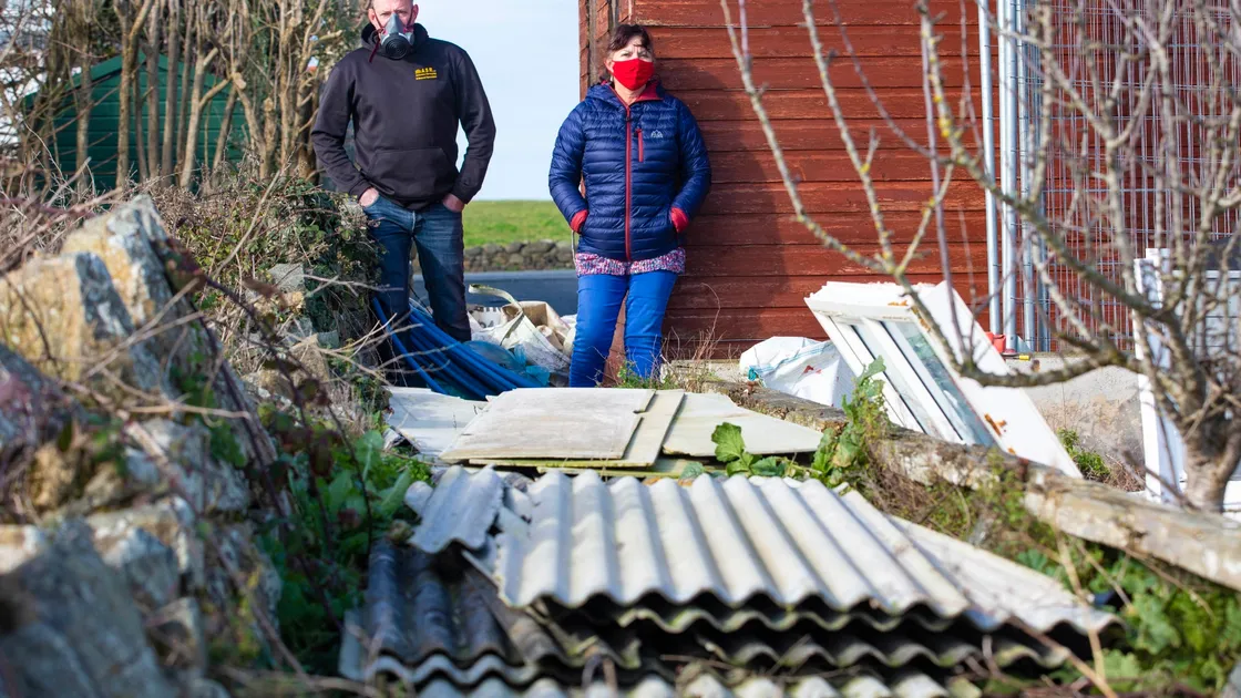 Carol Falla with Paul Knight,of specialist asbestos removal firm ASR, who is going to make the material safe free of charge. (Pictures by Peter Frankland, 29239342)