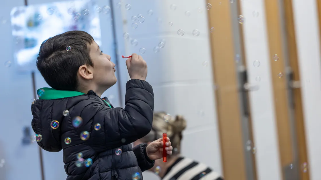 Leo Smith blows bubbles on one of the stands at the Joyous Childhood family event held at Les Beaucamps School last month, which highlighted early years issues