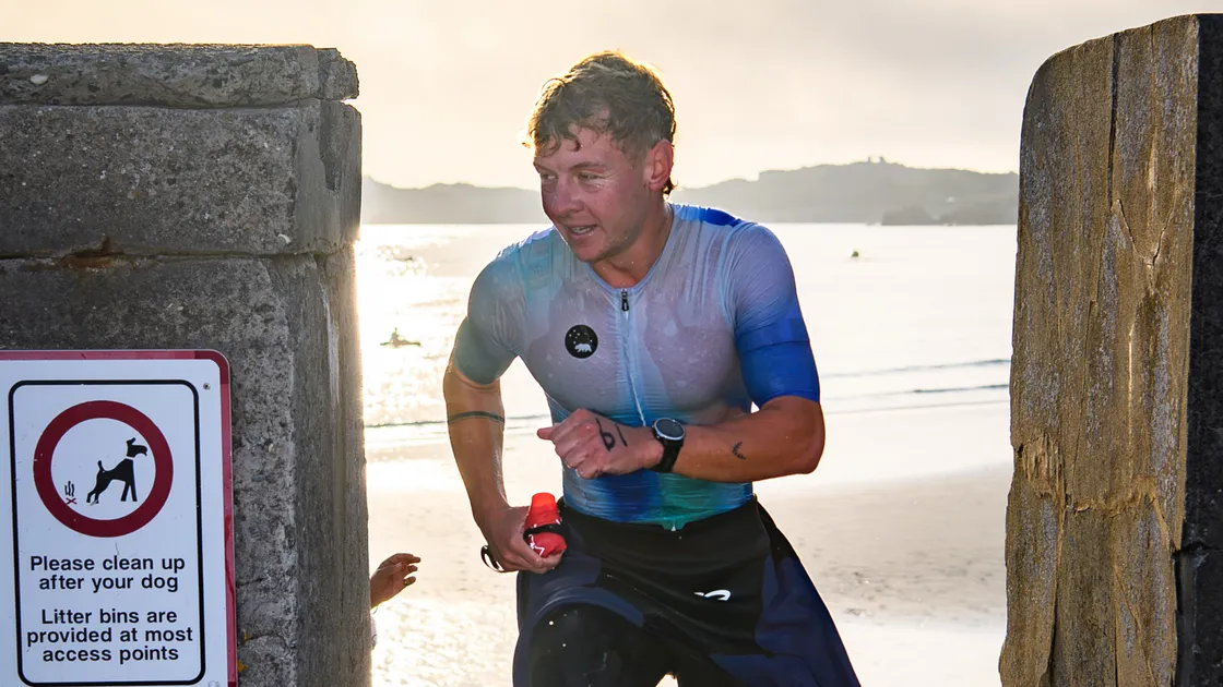 Ethan Woodhead has cracked the two-hour barrier for the Olympic distance triathlon.