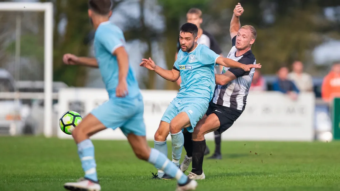 North captain River Marsh and Ben Coulter contest for the ball in Saturday's game at Blanche Pierre which saw the chocolate-and-blues go down 3-2. North coach Jose Alvarez said his team did not deserve to lose. (Picture by Martin Gray, 28707914)