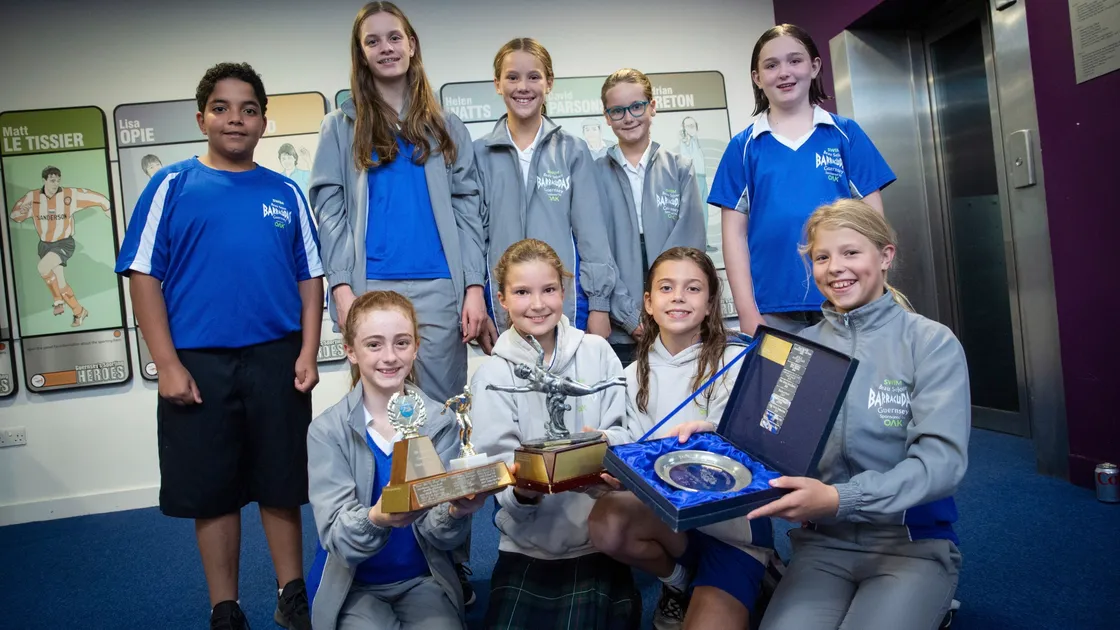 A glittering array of trophies for the Beau Sejour Barracudas 11 and under and 12/13 years teams. Back row, left to right: Belalosama Abouelela, Holly Jones, Jessica Boyle, Amelia Rodliffe, and Tiffany Fitzgerald. Front row: Eve Hartley, Megan Carter, Eden Smith and Emily Hyland. (Pictures by Peter Frankland. 30086829)