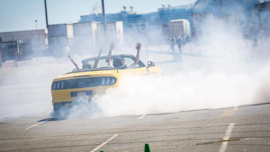 Look, no hands. Stunt driver Paul Swift doing doughnuts in his Mustang. (Pictures by Sophie Rabey, 31019616)