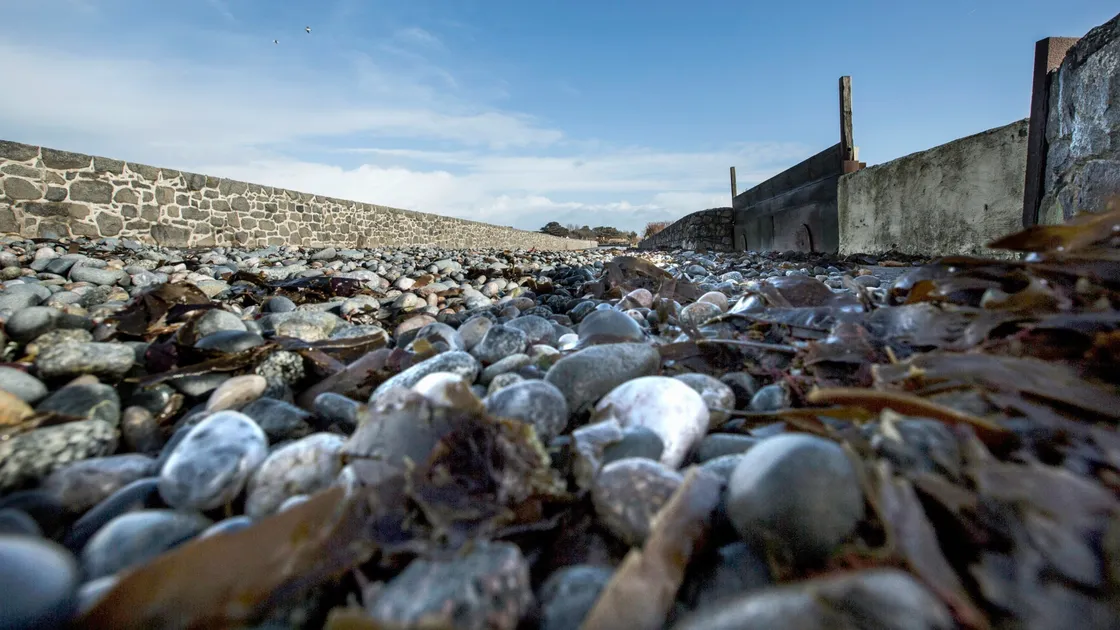 Pic by Adrian Miller 11-02-20.Perelle St Saviour's Coast Road clean up by States Works after Storm Ciara.Coast road covered with stones. (27143983)