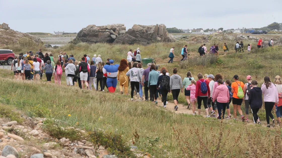 In a scene reminiscent of the Pink Ladies’ Sunset Coastal Walk, hundreds of people walked from Grandes Rocques to Rousse and back to raise money for Les Bourgs Hospice. (Pictures by Adrian Miller, 28484273)