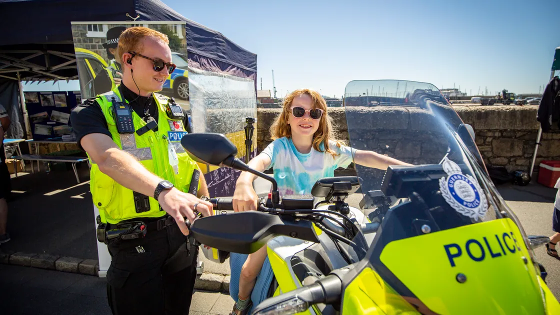Guernsey Police used the event for some public engagement with  Ruby Brittain, 6, taking the seat on Shane Harvey’s motorbike. (31019598)
