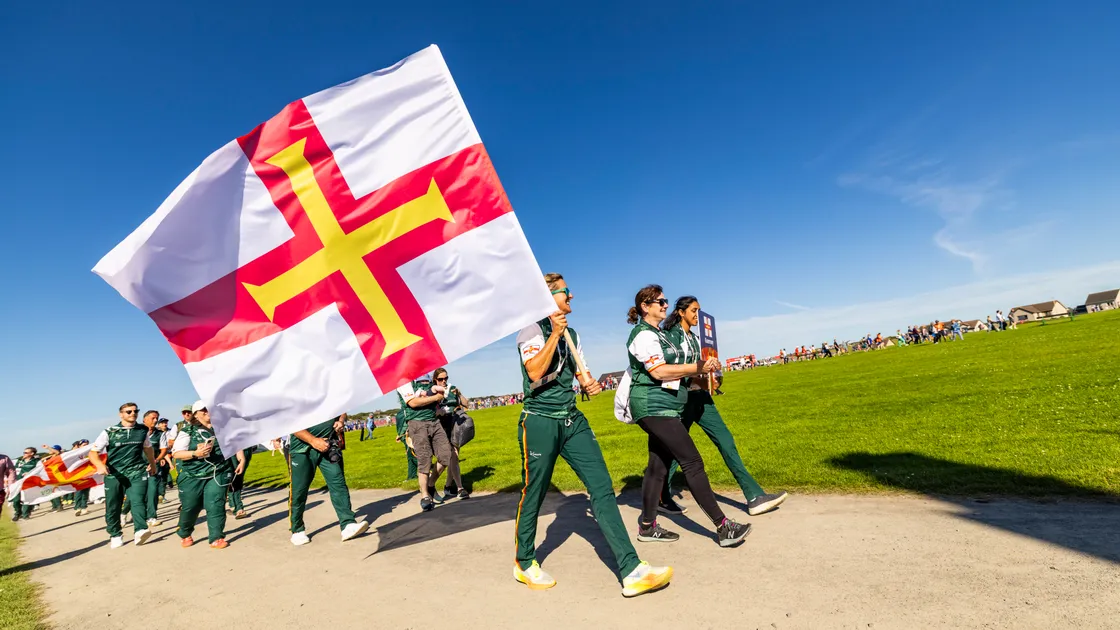 Triathlete Amy Critchlow carried Guernsey’s flag.