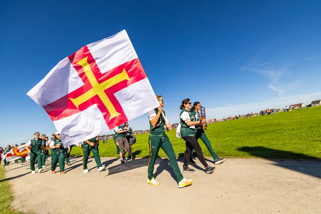 Triathlete Amy Critchlow carried Guernsey’s flag.