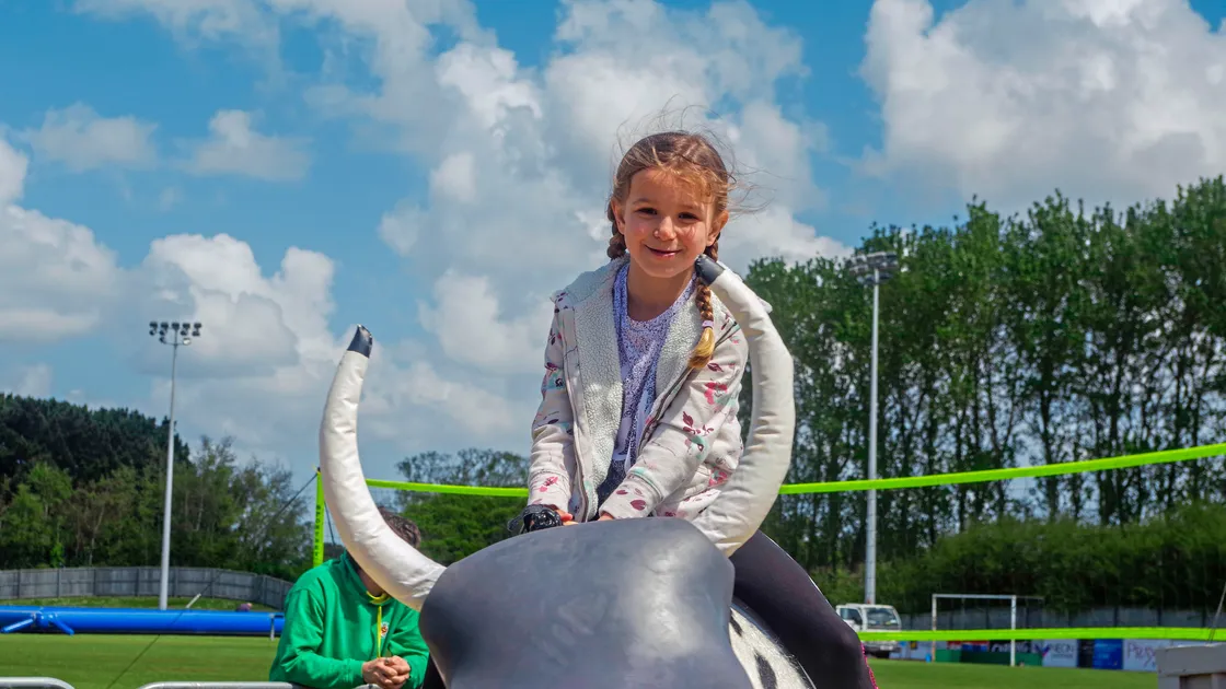 Picture by Lucy Darke
Ellie Tostevin (7) Riding the mechanical bull (24590080)