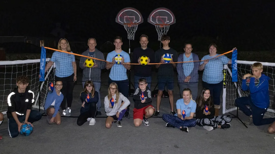 Volunteers and youngsters from Vazon Elim Youth Club with the new sports equipment purchased through the Condor Community Fund. (30260142)