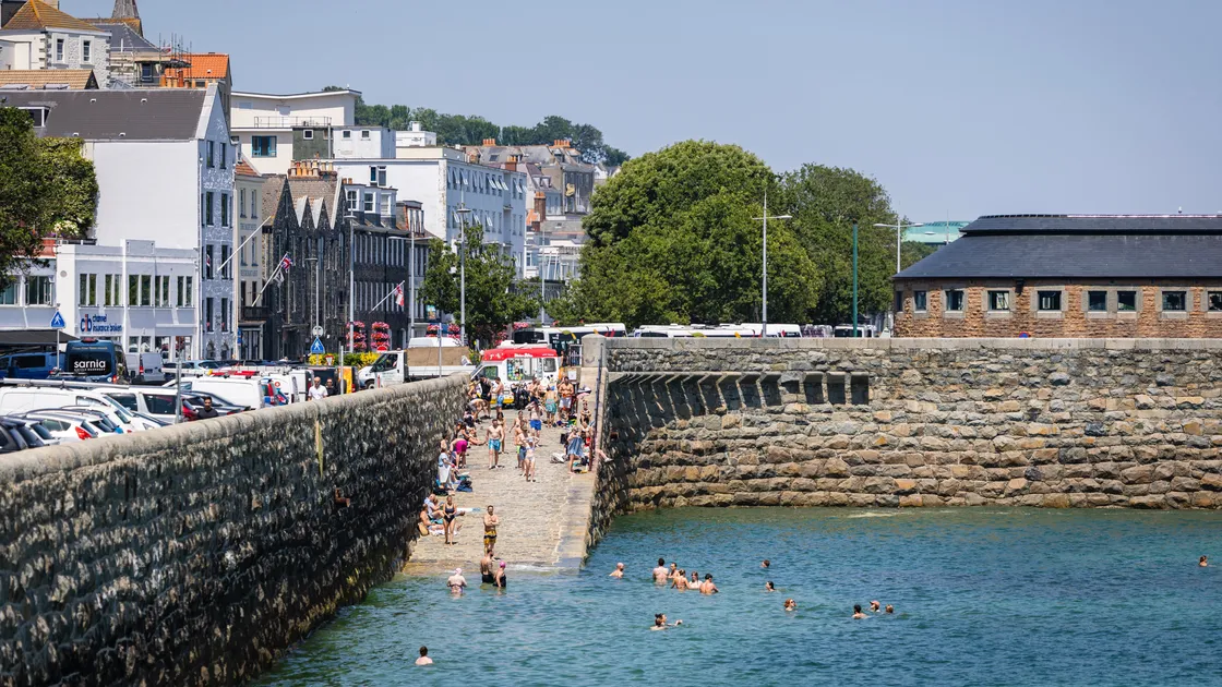 Lots of people took the opportunity to cool off in the sea yesterday as the hot weather continued, with a high of 33.8C recorded at the airport.