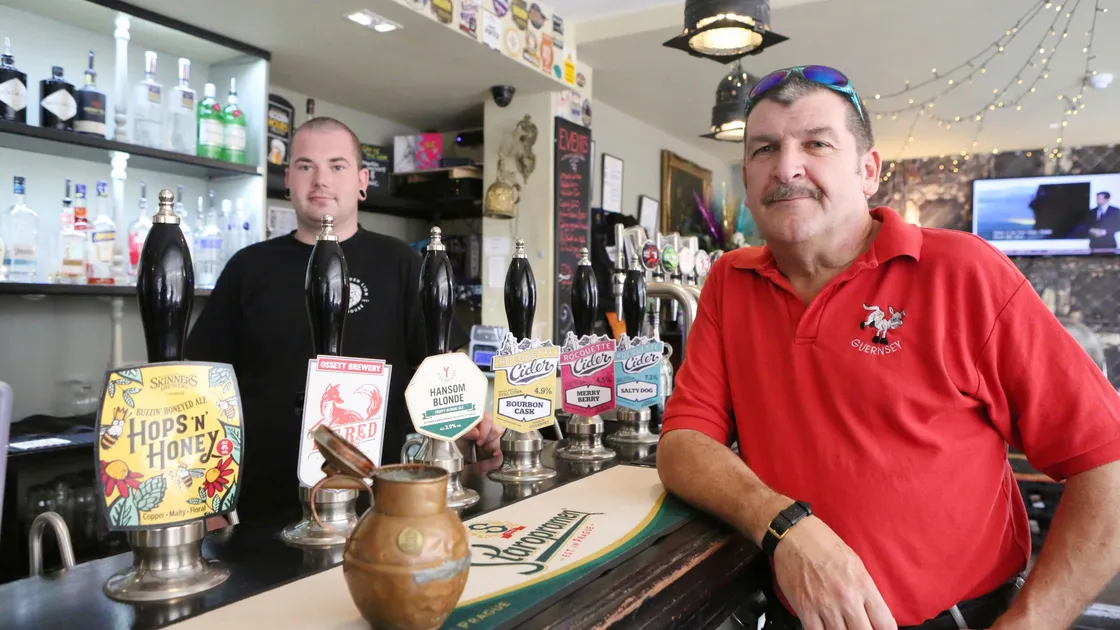 Shaun Marsh, right, in The Golden Lion pub in Market Street. Mr Marsh is chairman of the revived Guernsey branch of the Campaign for Real Ale, which is hoping to increase membership. Also pictured is Aaron Thompson. 	 		 (Picture by Steve Sarre, 22463580)