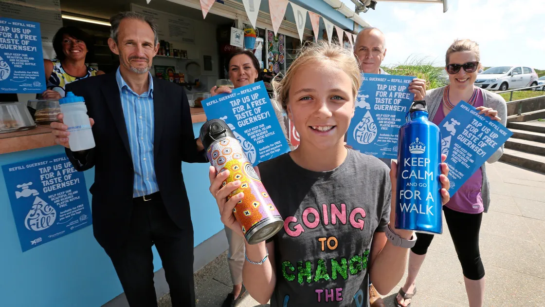Pic by Adrian Miller 21-06-18    
Surfside Kiosk Port Soif Vale
Launch of new initiative idea to have refill stations around the island to reduce the amount of plastic bottles. The idea came from Destiny Hollyer-Hill 11 nearest the camera, standing behind her l,r are Elke Schimek manager of kiosk, Phil Marquis Guernsey Water, Tina Norman-Ross recycling officer, Deputy Barry Brehaut from E&I and Laura Havard from Plastic Free Guernsey. (21792925)