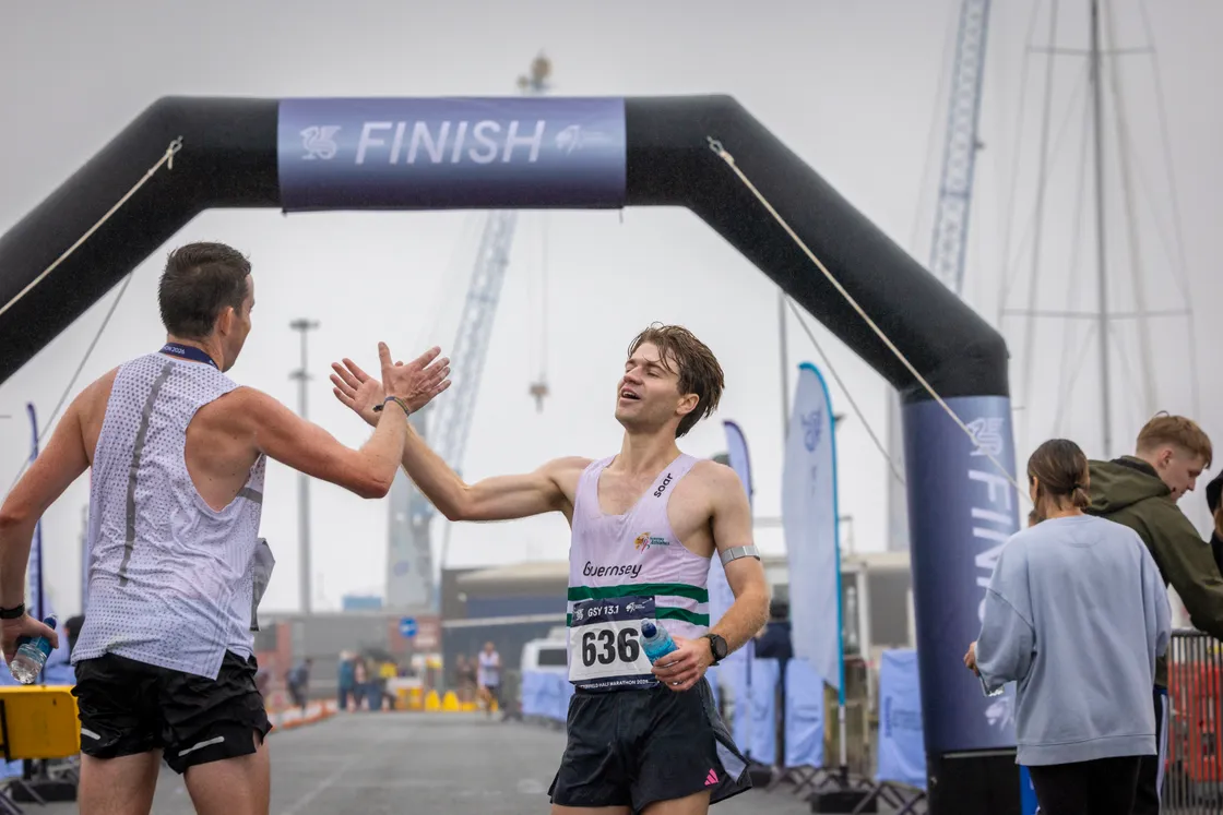 Overall runner-up James Priest high-fives Mikey Ingrouille after his own podium result.