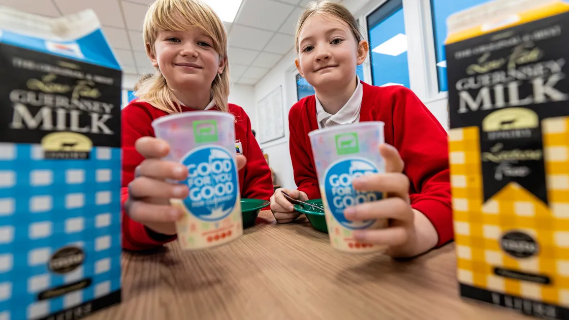Vale pupils Winston Beharrell, left, and Naomi Stonebridge, both 8. Guernsey Dairy is supplying Milk for Vale School’s Breakfast Club in collaboration with Island Health. 		 (Picture by Peter Frankland, 34572414)