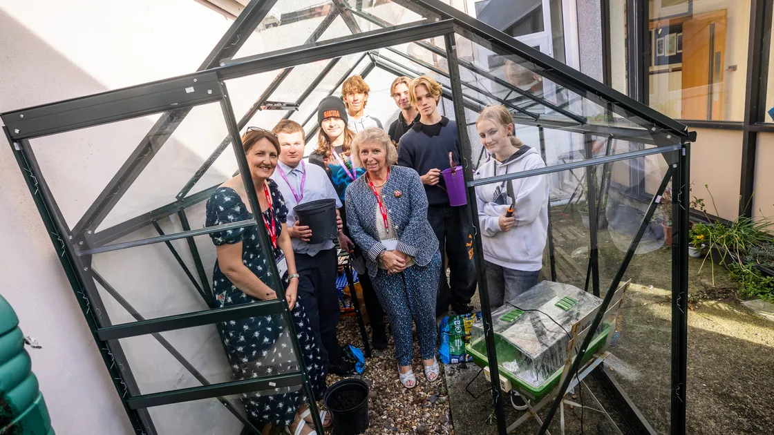 Rachael Hockey (centre) has funded a new greenhouse at the Sixth Form Centre. The students are using it in their Gardening Club as part of the personal enrichment programme. PTFA chair Nikki Lloyd is pictured left.