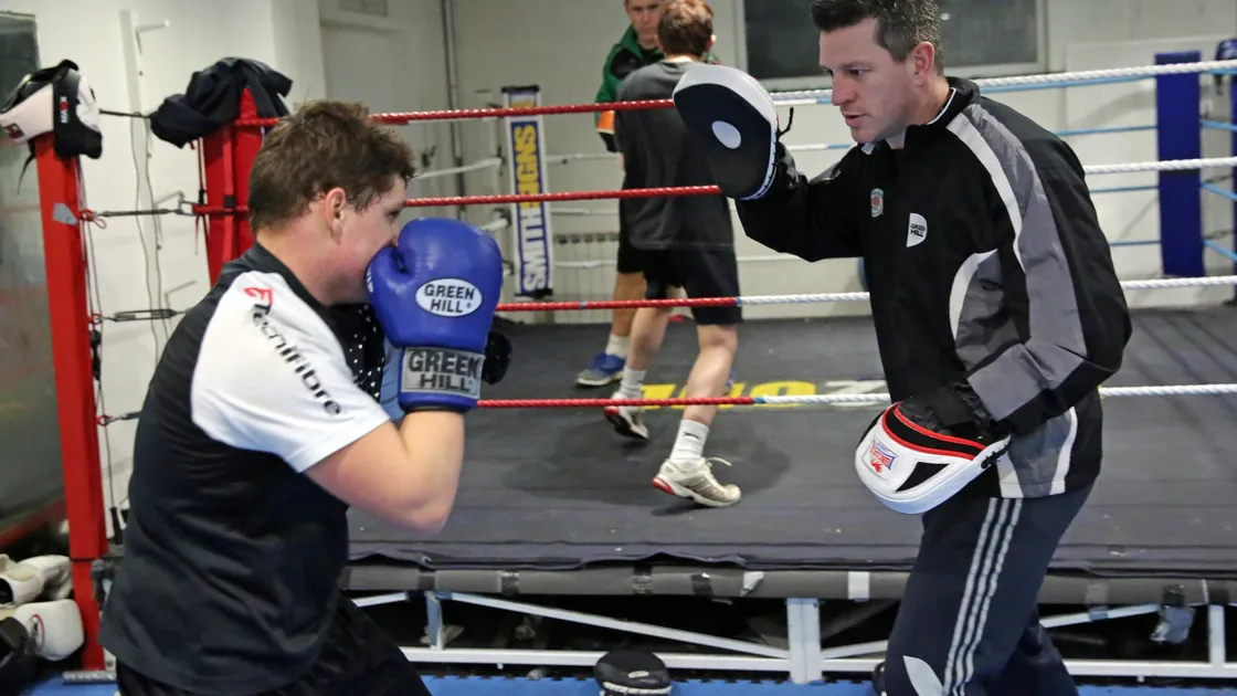 Head coach Ben Duff (right) with young Niall Adams on the ‘pads’ which is currently not permitted in the UK clubs. (28764860)