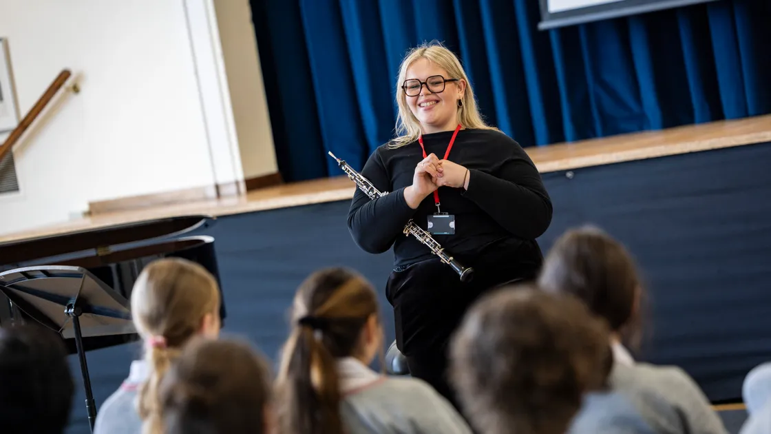 Sinfonia Smith Square orchestra oboist Annabelle Pizzey, who grew up in Guernsey, talking to students