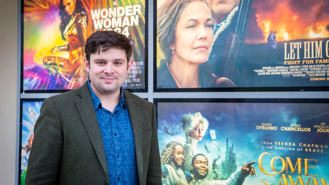 Mallard Cinema manager Daniel Phillips-Smith in front of posters for some of the films he hopes it will be able to show soon following its brush with national media fame. (Picture by Sophie Rabey, 29085415)